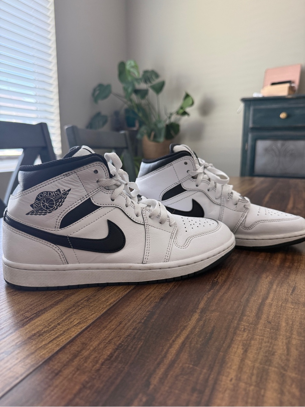 Nike Air Jordan 1 White and Black Mid-Top Sneakers